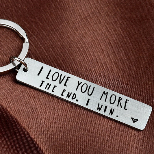 💓 BUY 1 GET 1 FREE! 🔑 "I love you more in the end I win" Funny Keychain – Playful design, durable metal & lightweight – Perfect birthday gift for couples & friends 🎁